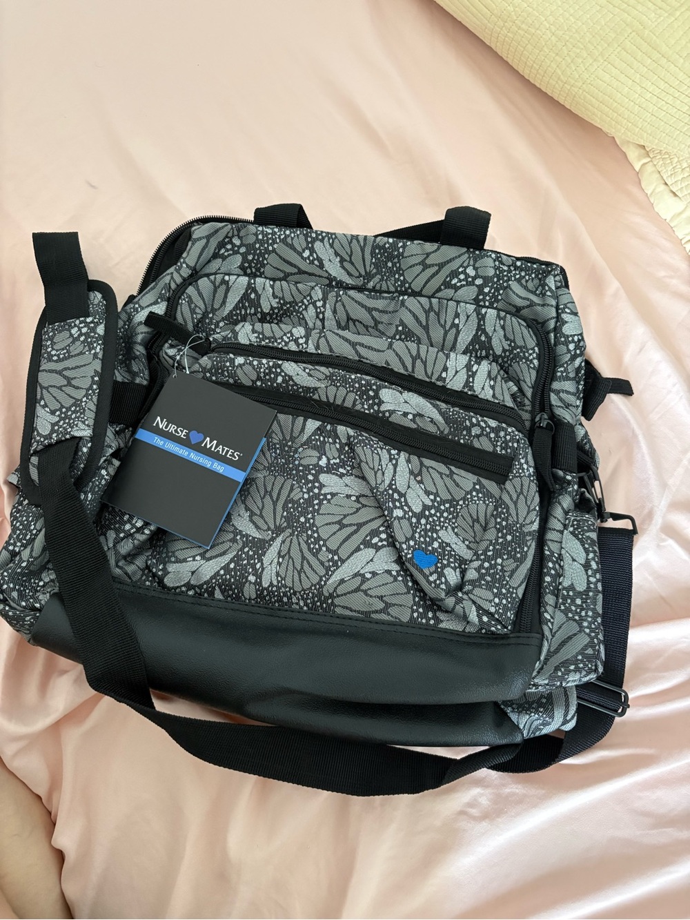 Nurse Mates Black and Gray Butterfly-Pattern Messenger Bag with Blue Logo Accent